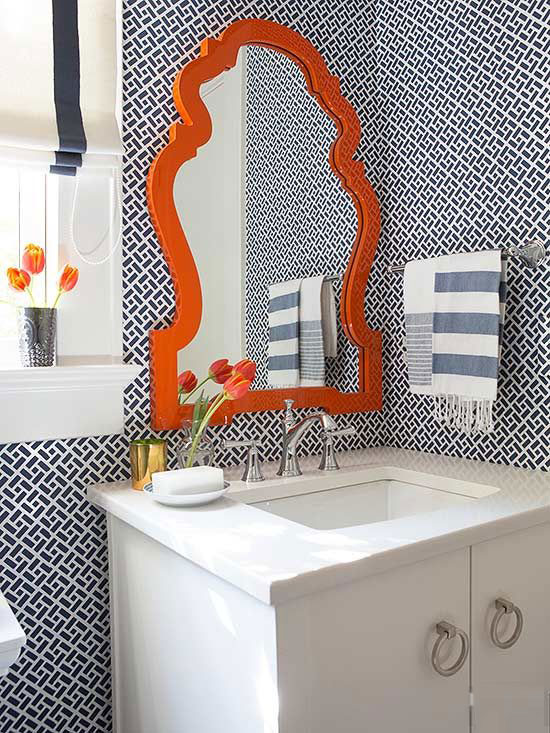 amazing bathroom with blue tiles and orange accent mirror luxazin