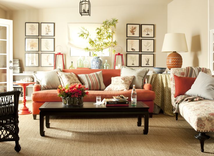 cozy living room using orange sofa with white wall luxazin